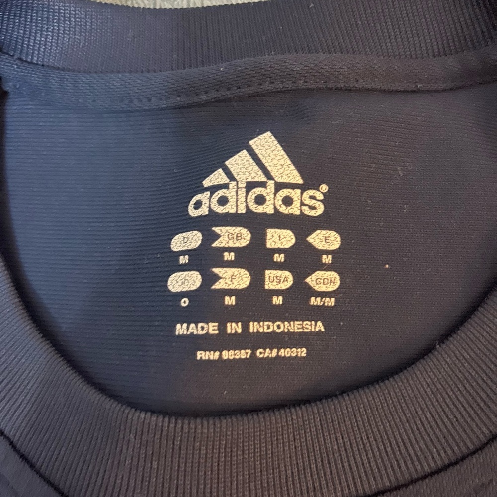 Men’s adidas navy blue shirt with reflective stripes on arms for running